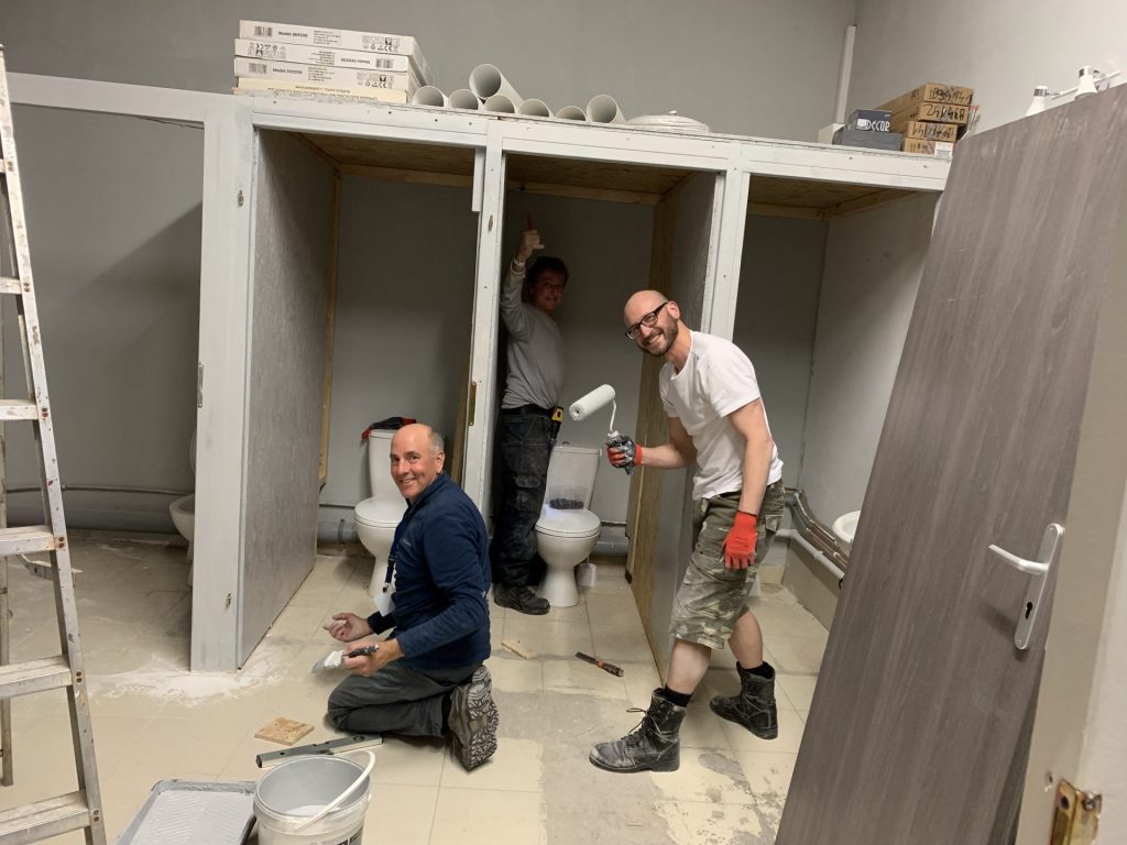 Dream team trio of Tim, Tony & Fab working on the bathroom construction of the Actions Beyond Words volunteer base in Medyka