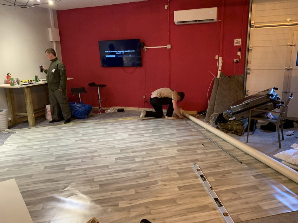 Nathan Mullaney, Alex Clowes and Simon Massey installing lino into the Actions Beyonds Words Medyka base at 02:00!!