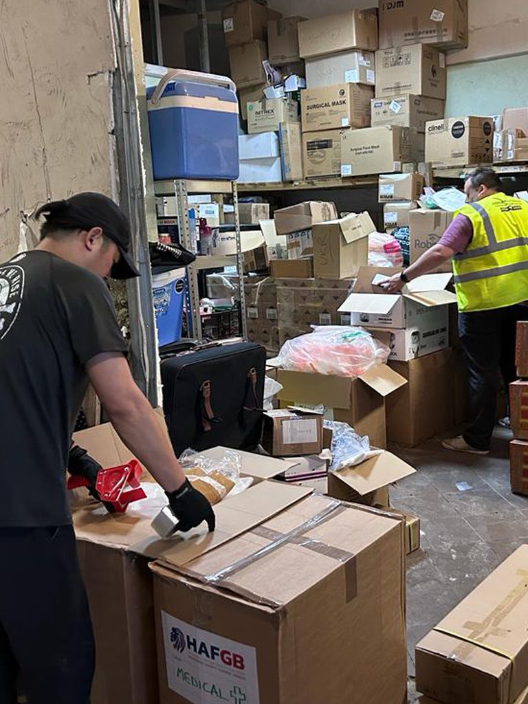 Simon Massey and Akira Nagao loading aid from the warehouse in Medyka