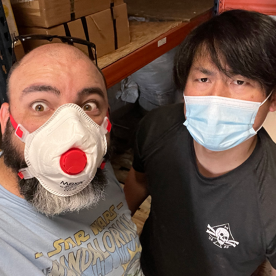 Travis Goode and Akira Nagao cleaning ABW's warehouse in Medyka.