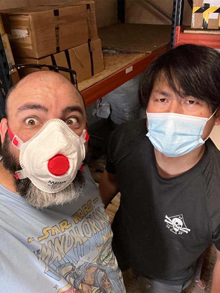 Travis Goode and Akira Nagao cleaning ABW's warehouse in Medyka.