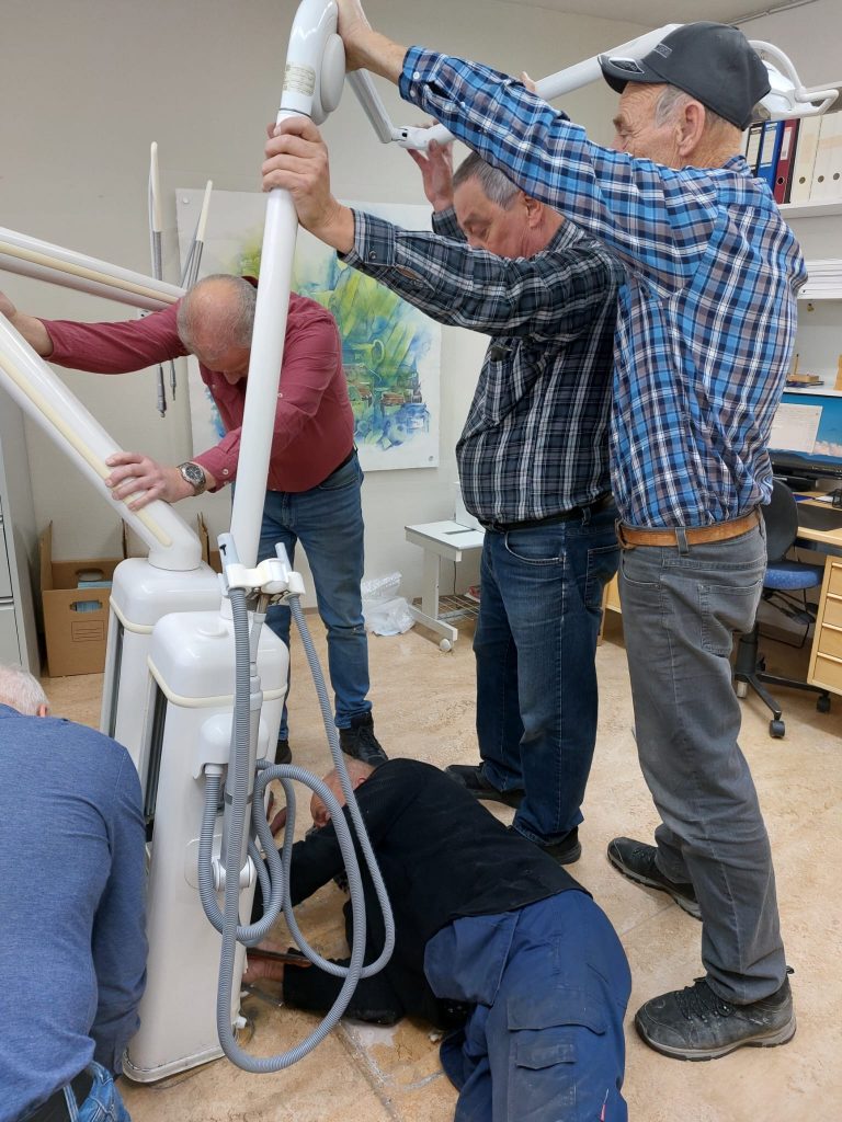 Finland Dentists and team removing the dental suite in Finland ready to send to Ukraine